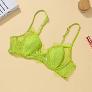 Neon green lace bra detail view, adjustable strap and sheer floral cup, intimate apparel.