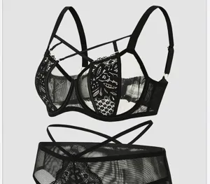 Sexy black lace lingerie set with strap details, push-up bra and matching panties for women.