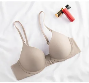 Seamless front closure push-up bra, smooth nude daily comfort undergarment detail view.