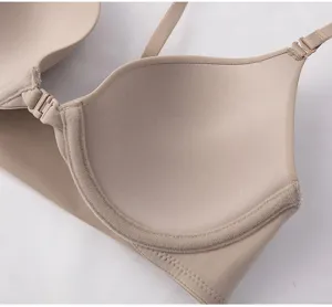 Seamless nude front-closure bra close-up detail shot, soft fabric and daily wear support.