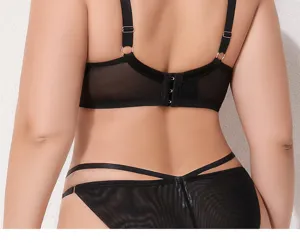 Detailed back view of plus size black mesh bra and panties featuring adjustable straps.