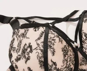Plus size full cup bra detail shot, breathable mesh fabric with elegant black embroidery.
