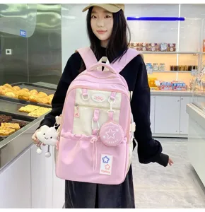 Detailed view of the cute campus pink backpack featuring star patches, charm pendant, and large capacity.