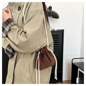 Cute strawberry corduroy bucket bag for women, stylish shoulder messenger bag daily use.