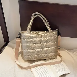 Metallic gold puffer tote bag, stylish quilted shoulder crossbody handbag for women casual daily.