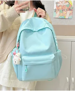 Casual light blue student backpack with front pocket and cute bear pendant for daily use.