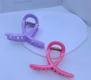 Medium pink and purple hair claw clips, elegant daily styling accessory for women and girls.
