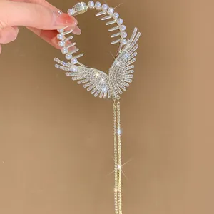 Elegant rhinestone angel wings hair claw clip with sparkling tassel chains for women.