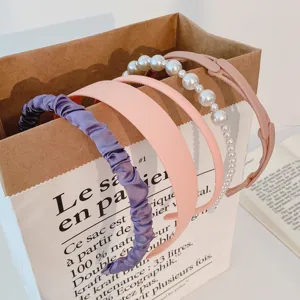 Set of stylish women headbands featuring ruched fabric, pearls, and solid colors for daily wear.