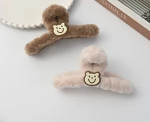 Cozy plush hair claw clip with cute bear patch, large winter hair accessory for women.