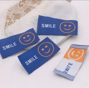 Colorful smile woven fabric labels for DIY hair accessories and clothing decoration projects.