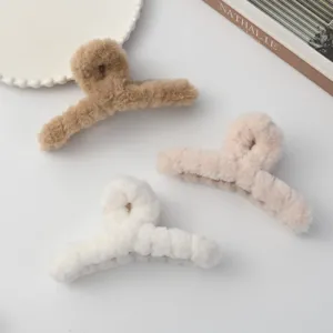 Plush hair claw clip for women, large winter fluffy hair catcher, cute brown and white hair accessories.