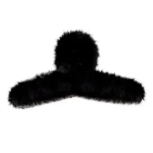 Large black plush hair claw clip for women, fluffy winter hair accessory, shark clip style.
