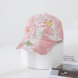 Pink tie-dye gradient baseball cap featuring sparkling rhinestones and chic butterfly details.