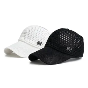 Detailed view of breathable mesh empty-top sun hat with rhinestone M logo, summer shade.