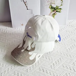 Rhinestone flame baseball cap detail, trendy white street style hat for outdoor sun protection.