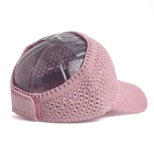 Pink knitted empty-top sun hat, hollow breathable wide brim design for summer outdoor wear.