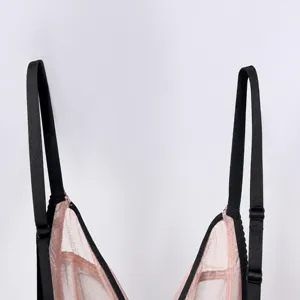 Close-up detail of wireless lace bra cup and adjustable black straps, lightweight mesh.