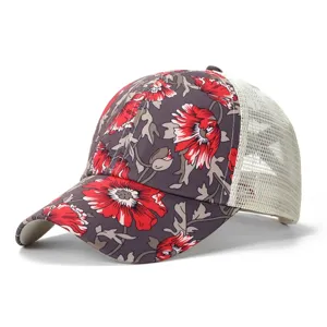 Floral print and breathable mesh detail of the women's trucker baseball cap view.