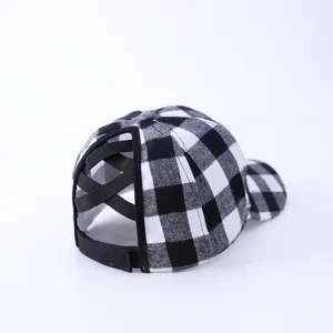 Black and white buffalo plaid ponytail baseball cap with cross elastic back opening detail.