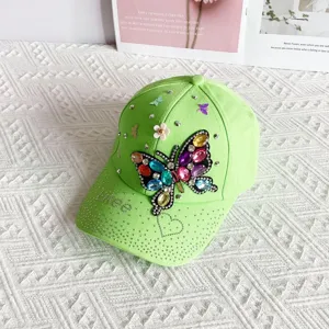 Green rhinestone butterfly baseball cap with sparkling gems, stylish casual sun visor hat.