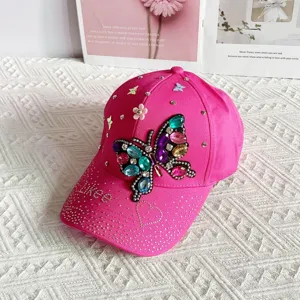 Hot pink rhinestone butterfly baseball cap, detailed crystal bling sun hat for women.