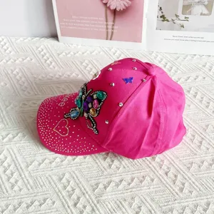 Pink rhinestone butterfly baseball cap, stylish sunshade hat for women outdoor casual wear.