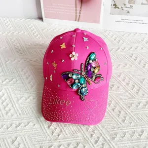 Stylish pink baseball cap featuring rhinestone butterfly and heart designs for women outdoor sun protection.
