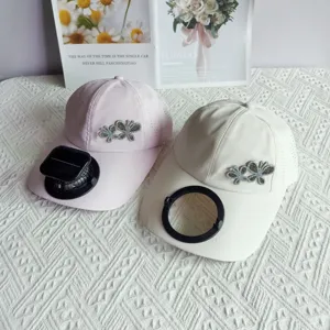 Quick-dry baseball cap with solar fan and rhinestone butterfly decoration for summer sun protection.
