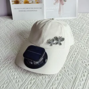 White quick-dry baseball cap featuring a solar charging fan and rhinestone butterfly decor.