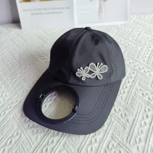 Quick-dry baseball cap with rhinestone butterfly and extended brim, solar fan mounting ring.