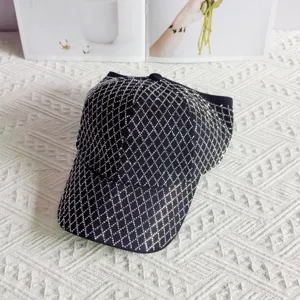 Rhinestone baseball cap detail view, black diamond lattice design sparkling sun hat for women.