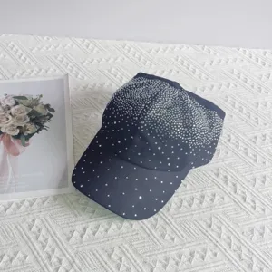 Close up view of the sparkly rhinestone embellished baseball cap showing starry crystal details.
