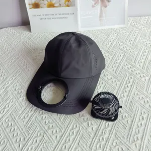 Detailed view of black quick-drying solar fan baseball cap, extended brim and portable mini fan.