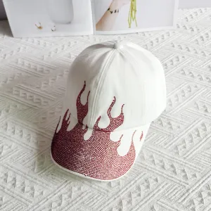 White baseball cap with sparkling red rhinestone flame design, trendy street style hat.