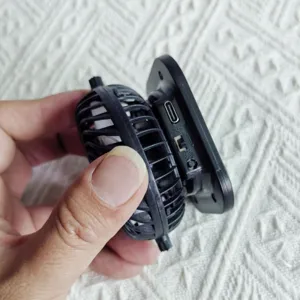 Close-up detail of the portable mini fan charging module with Type-C port for sun hat.