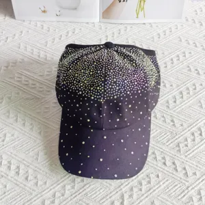 Stunning rhinestone embellished black baseball cap for women, sparkling gradient crystal design.