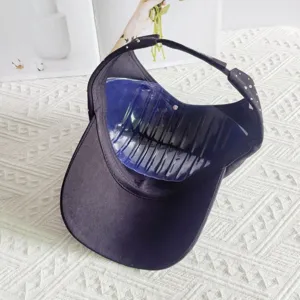 Detailed view of a trendy rhinestone embellished half empty top baseball cap for women.