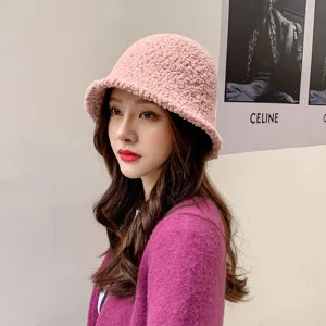 Pink fleece bucket hat for women, casual warm plush fisherman cap with wide brim for winter.