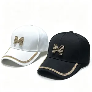 Rhinestone letter M baseball cap detail, sparkling crystal brim edge, casual sun hat.