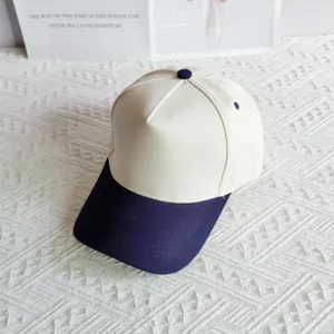 Detailed view of a two-tone cotton baseball cap with structured panels and a curved brim.