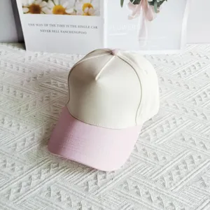 Two-tone baseball cap with beige crown and pink brim, casual five-panel design for daily sun shade.