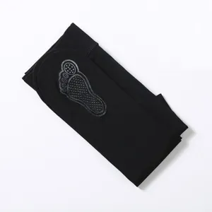 Black anti-slip tights detail view, featuring comfortable fabric and reliable sole grip design.