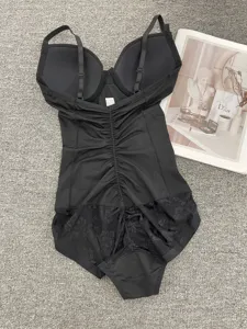 Black one-piece shapewear bodysuit with built-in bra, postpartum tummy control and lace design.