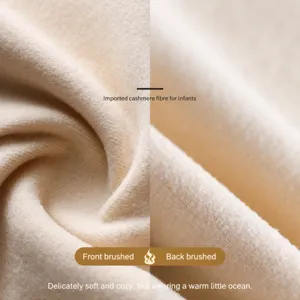 Beige thermal German velvet fabric close-up, ultra-soft cashmere touch for warm base layer wear.