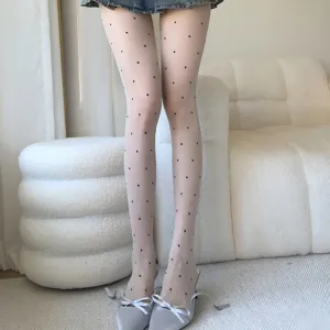 Collants transparents à pois blancs ultra fins bas de femme pour la saison estivale.