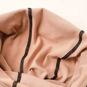Flesh-colored translucent pantyhose detail with black stitching for women daily wear.