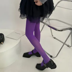 Vibrant purple velvet tights featuring a sleek high-elastic fit, perfect for stylish autumn outfits. Detail.