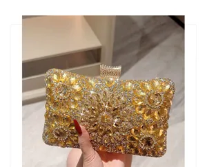 Stunning gold rhinestone clutch bag detail, sparkling crystal evening purse close-up view.
