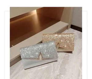Sparkling rhinestone evening clutch bag with metal V clasp, perfect for weddings and parties.